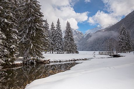 The snow-covered landscape of Lake Anterselva, Pusteria Valley, Italy