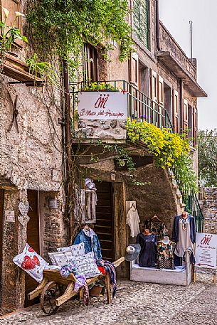 Small atelier in the characteristic alley of Malcesine on Lake Garda, Italy