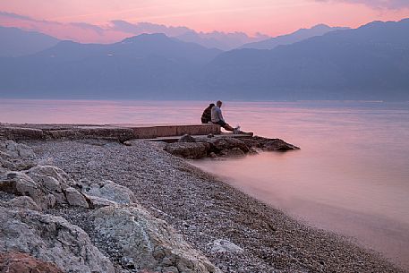 A romantic sunset over Garda lake at Malcesine, Italy
