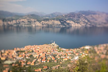 View from the top of the small medieval village of Malcesine with the Scaligero castle overlooking Garda lake, Italy