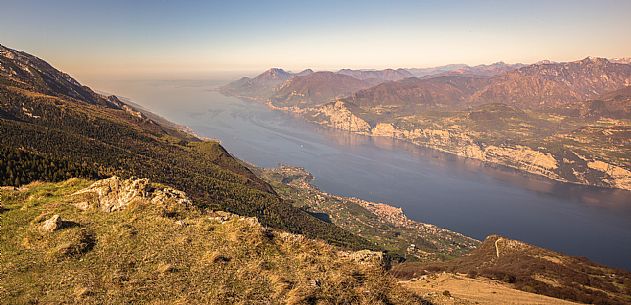The Garda lake photographed by Mount Baldo, on the right the small medieval village of Malcesine with its castle Scaligero, Italy