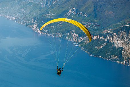 Paragliding runs from Mount Baldo above Garda lake, italy