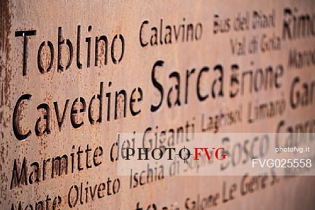 Tag along Lake Toblino with engraved names of the surrounding villages, Valley of Lakes, Trentino, italy