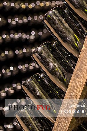 Aged bottles of the Cantina Pisoni located between the Dolomites and Lake Garda, specializing in Vino Santo, red and white wines of Trentino Alto Adige, Valley of Lakes, Valle dei Laghi, Italy