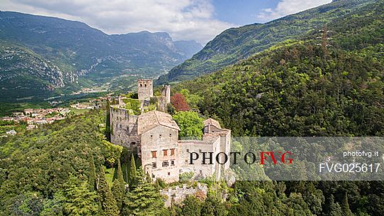 Castle Madruzzo from above, a medieval castle set on a rocky hill overlooking the homonymous village, Valley of Lakes, Valle dei Laghi, Trentino, Italy 