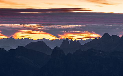 Fiery sunset on the Odle group from the Lagazuoi refuge, Cortina D'Ampezzo, Dolomites, Italy