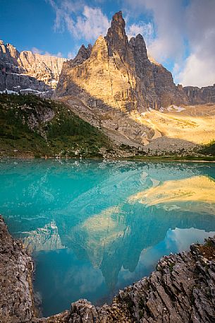 The Dito di Dio of  Sorapiss reflected on the emerald pond of the Sorapiss during a sunset, Cortina d'Ampezzo, Dolomites, Italy
