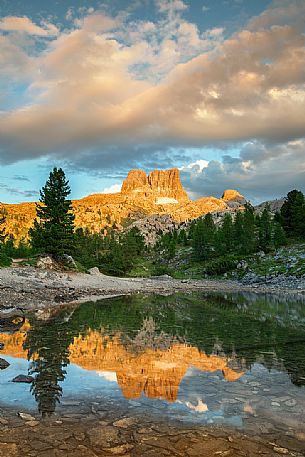 The Averau Mount reflected on the little pond of Limedes at sunset, Cortina D'Ampezzo, Dolomites, Italy