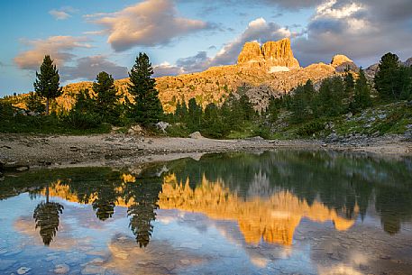 The Averau Mount reflected on the little pond of Limedes at sunset, Cortina D'Ampezzo, Dolomites, Italy