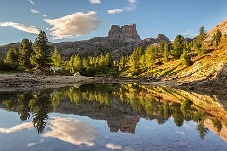 The Averau Mount reflected on the little pond of Limedes at sunset, Dolomites, Cortina D'Ampezzo, Italy