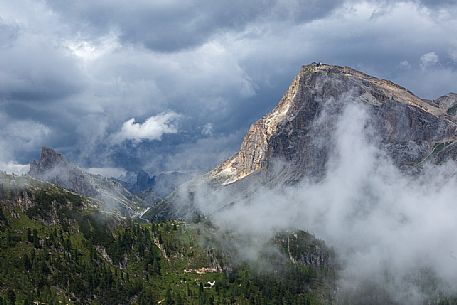The Piccolo Lagazuoi with the Lagazuoi hut wrapped in the clouds, Dolomites, Cortina d'Ampezzo, Italy