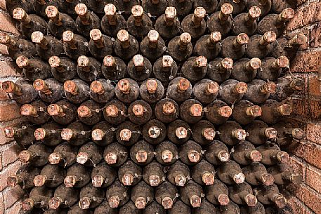 Aged bottles of the historic aging cellar of Castello di Spessa castle in Capriva del Friuli, Friuli Venezia Giulia, Italy