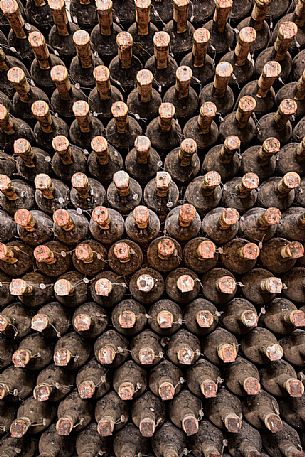 Aged bottles of the historic aging cellar of Castello di Spessa castle in Capriva del Friuli, Friuli Venezia Giulia, Italy