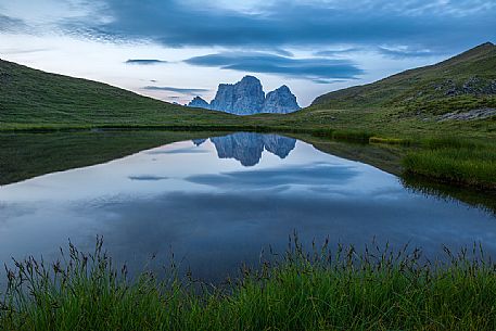 Pelmo mount reflected on Baste lake at twilight, Mondeval, Dolomites, Italy Pelmo mount reflected on Baste lake at twilight, Mondeval, Dolomites, Italy