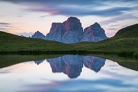 Pelmo mount reflected on Baste lake at twilight, Mondeval, Dolomites, Italy