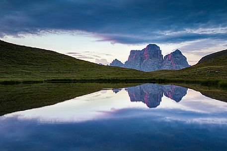 Pelmo mount reflected on Baste lake at twilight, Mondeval, Dolomites, Italy Pelmo mount reflected on Baste lake at twilight, Mondeval, Dolomites, Italy