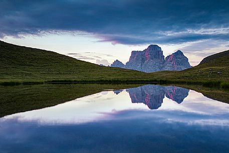 Pelmo mount reflected on Baste lake at twilight, Mondeval, Dolomites, Italy