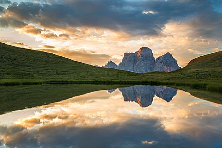 Pelmo mount reflected on Baste lake at twilight, Mondeval, Dolomites, Italy