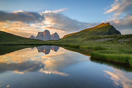 Pelmo mount reflected on Baste lake at twilight, Mondeval, Dolomites, Italy