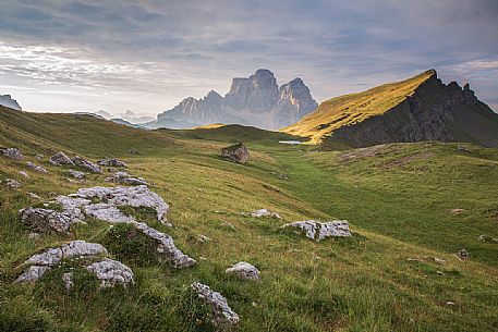 Pelmo Mount, Baste lake and the meadows of Mondeval during a summer morning, Dolomites, Alto Agordino, Italy Pelmo Mount, Baste lake and the meadows of Mondeval during a summer morning, Dolomites, Alto Agordino, Italy