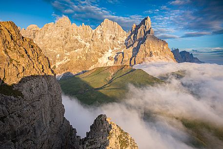 The northern chain of the Pale di San Martino over a cloud of clouds photographed from the top of the path of Cristo Pensante, Dolomites, San Martino di Castrozza, Italy