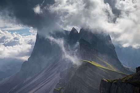 The Odle group wrapped in clouds after thunderstorms photographed from Seceda, Dolomites, Ortisei, Italy