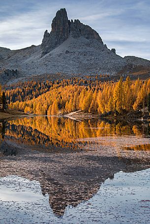The Becco di Mezzod peak reflected on the waters of Lake Federa on an autumn morning, Dolomites, Cortina D'Ampezzo, Italy