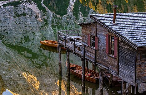 The little wooden house on the Braies lake, Dolomites, Pusteria Valley, Italy