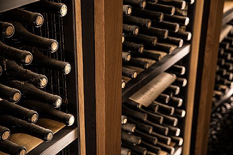 Detail of wine bottles in the historic winery Cordero di Montezemolo in the heart of the Barolo wine production area, La Morra, Langhe, Unesco World Heritage, Piedmont, Italy, Europe