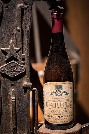 Old bottle of Barolo red wine from the historic winery Cordero di Montezemolo in the municipality of La Morra, Langhe, Unesco World Heritage, Piedmont, Italy, Europe