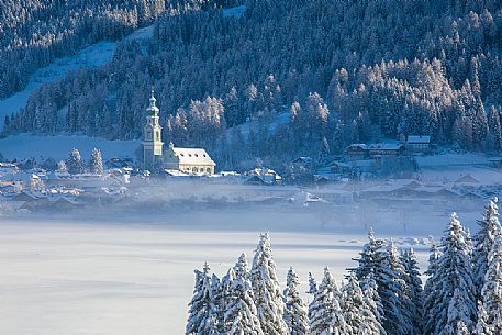 The village of Dobbiaco after an intense snowfall, Pusteria valley, dolomites, Trentino Alto Adige, Italy, Europe