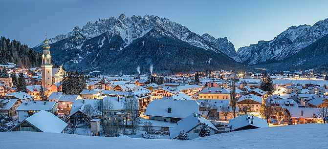 The village of Dobbiaco illuminated at the blue hour, Pusteria valley, dolomites, Trentino Alto Adige, Italy, Europe The village of Dobbiaco illuminated at the blue hour, Pusteria valley, dolomites, Trentino Alto Adige, Italy, Europe