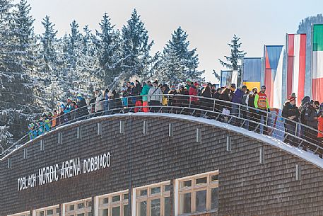 Tourists at the World Cup cross-country skiing at the Nordic Arena in Dobbiaco, Pusteria valley, dolomites, Trentino Alto Adige, Italy, Europe Tourists at the World Cup cross-country skiing at the Nordic Arena in Dobbiaco, Pusteria valley, dolomites, Trentino Alto Adige, Italy, Europe