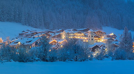 The lights of the Moso' s village in the winter night, Sesto, dolomites, Pusteria valley, Trentino Alto Adige, Italy, Europe