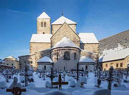 The collegiate church of San Candido and the cemetery, Pusteria valley, Trentino Alto Adige, Italy The collegiate church of San Candido and the cemetery, Pusteria valley, Trentino Alto Adige, Italy