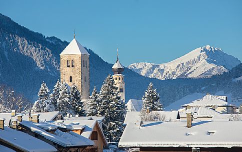 View over the roofs of San Candido with the Collegiata and the bell tower of the church of San Michele, Alta Pusteria, Trentino Alto Adige, Italy View over the roofs of San Candido with the Collegiata and the bell tower of the church of San Michele, Alta Pusteria, Trentino Alto Adige, Italy