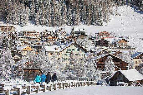 Tourists visiting the village of Sesto after an intensive snowfall, dolomites, Pusteria valley, Trentino Alto Adige, Italy, Europe