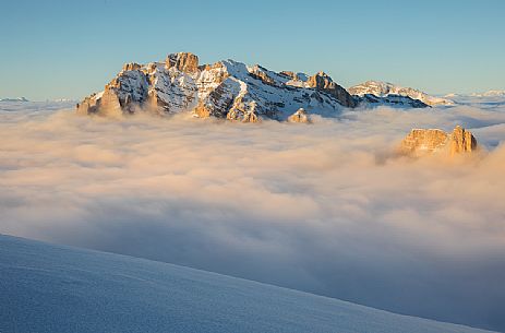 The Conturines mount at sunset above a sea of clouds, Badia valley, dolomites, South Tyrol, Italy, Europe