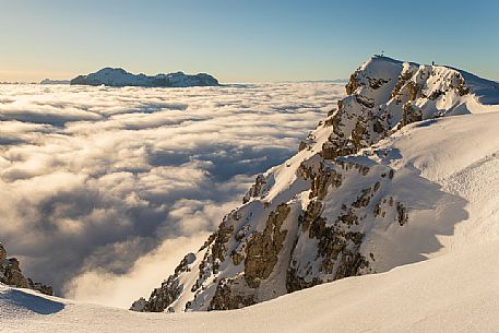 Lagazuoi peak and sea of clouds at sunset from the Lagazuoi refuge, in the background the Sella mountain range, dolomites, Italy, Europe Lagazuoi peak and sea of clouds at sunset from the Lagazuoi refuge, in the background the Sella mountain range, dolomites, Italy, Europe