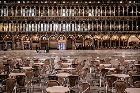 Tables of the most famous bar called Caff Florian in the San Marco square by night, Venice, Italy, Europe