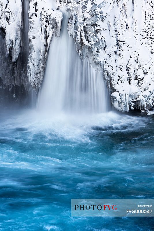 The frozen detail of a small waterfall nearby Godafoss.