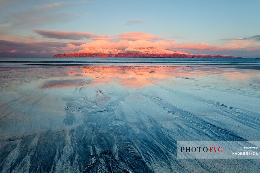 The First Light kisses Rum Mountaing on the background