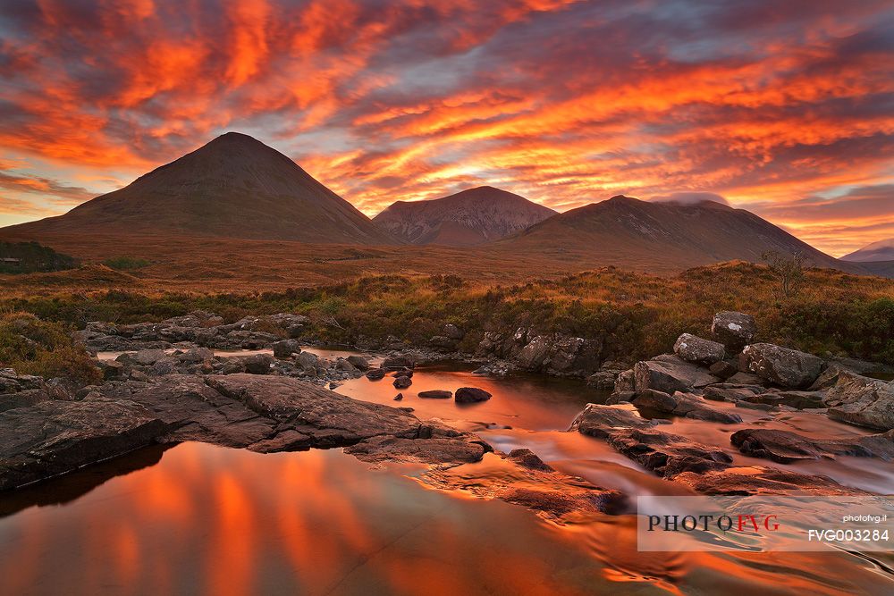 The sky above the Red Cuillin looks like a fireworks show during an impressive sunrise