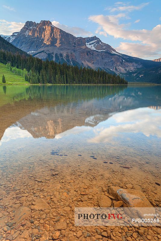 Reflections into the Emerald Lake water at late Afternoon