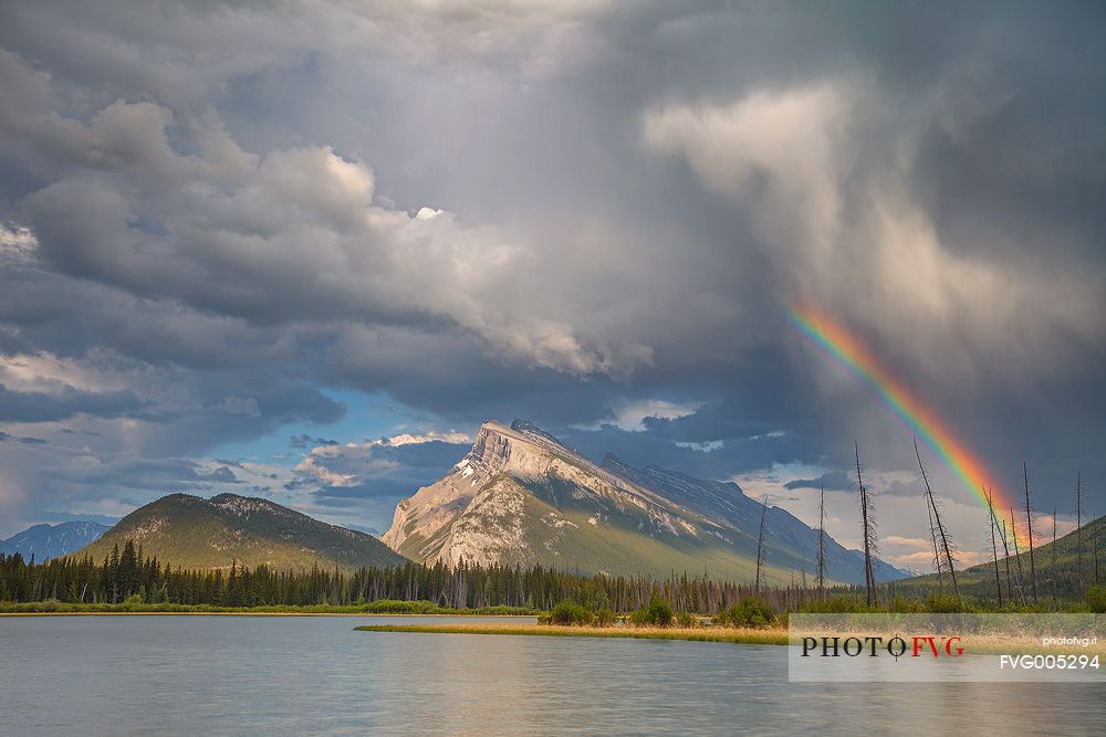 Storm and rainbow above Mount Rundle at Vermillion lake