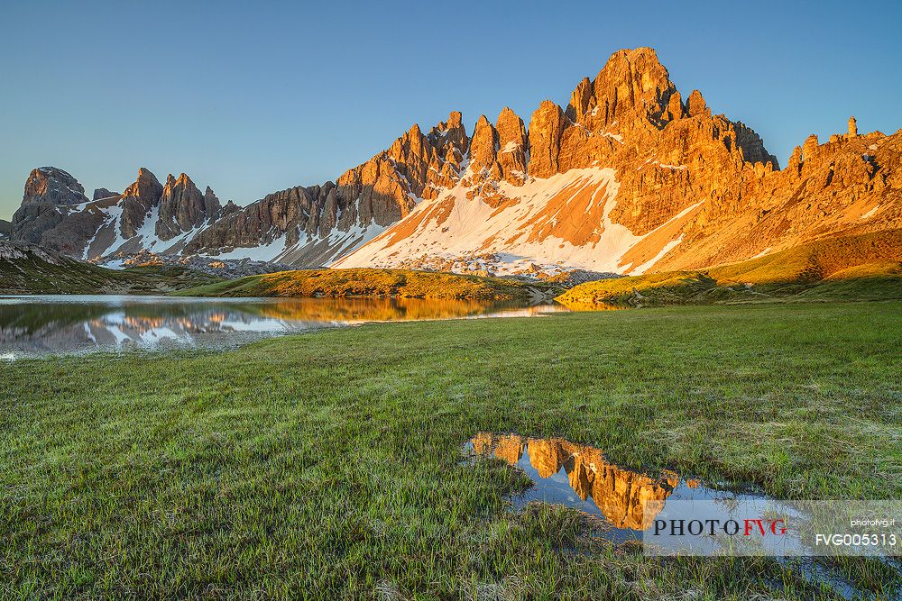 The reflection of Mount Paterno in a little puddle just after the Winter snow was melted