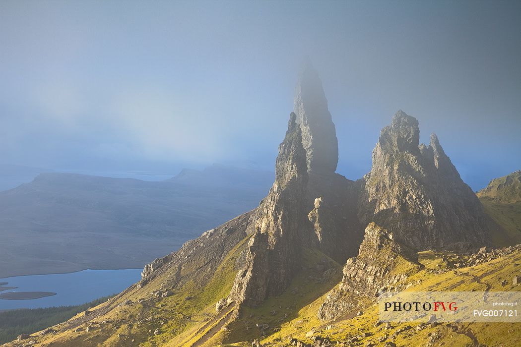 The clouds embraced the famous pinnacle of Old Man of Storr during a misty morning