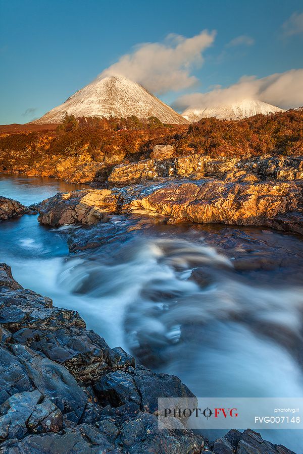The golden light in the afternoon kisses the landscape at Sligachan