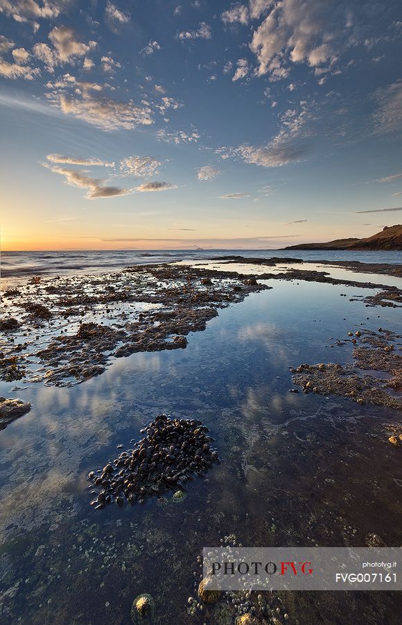 Shells, stone and reflection at Score bay