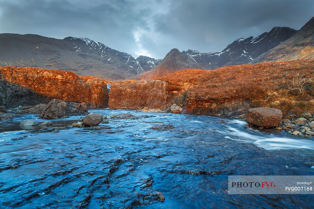 After months of rain the streams at Glen Brittle are powerful than ever. The waterfalls in all its glory and the last light of the day enhances the landscape of beauty